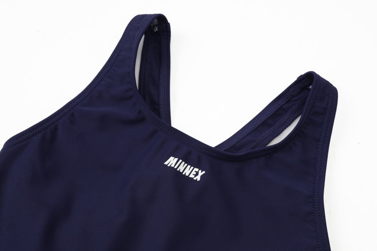 Close-up of the 深藍色女童練習泳衣 <68400616-D1>, featuring racerback straps and MINNEX printed in white near the neckline. Ideal for swimming practice or lessons, shown on a plain white background.
