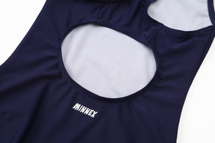 A close-up of a 深藍色女童練習泳衣 <68400616-D1> with white lining, two large back cutouts, and “MINNEX” in white letters, ideal for 游泳課專用.