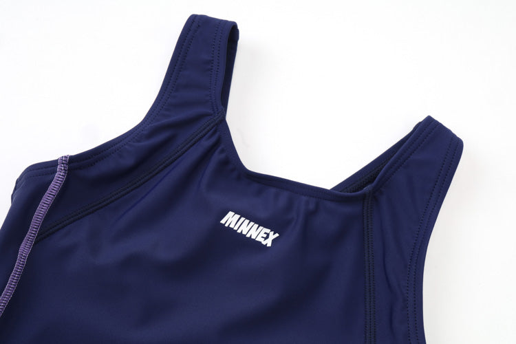 A close-up of the 深藍色女童練習泳衣 <68401830-H1>, a navy blue athletic tank top with thick straps and MINNEX in white on the chest. The stretchy fabric is perfect for 女童連身短褲泳衣 or 學校泳衣.