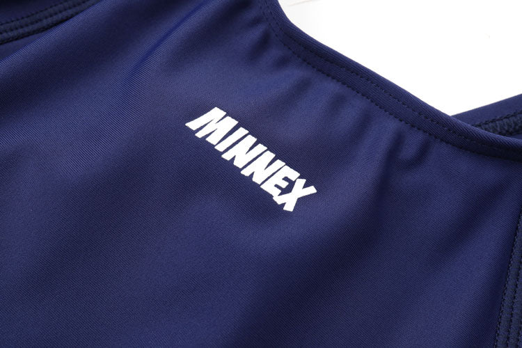 Close-up of a 深藍色女童練習泳衣 <68401830-H1> featuring navy blue fabric and white MINNEX lettering.