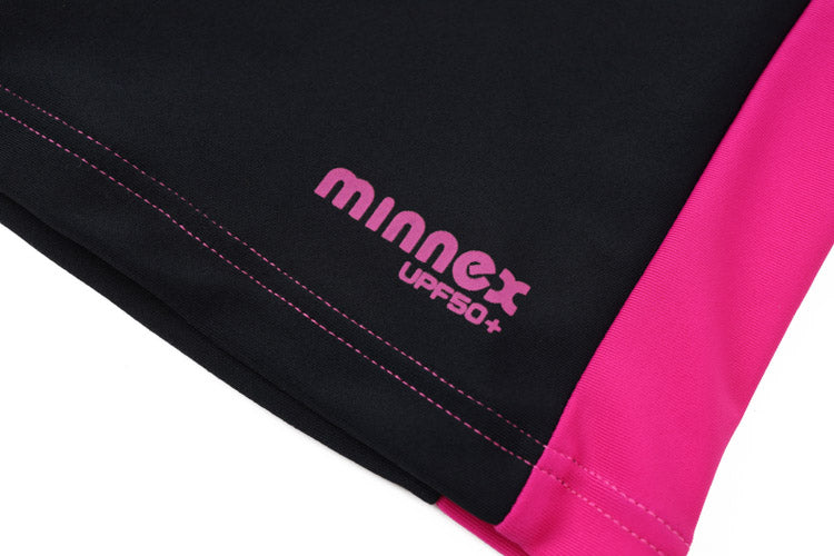 Close-up of black fabric with a bright pink edge and "minnex UPF 50+" in pink, highlighting our 黑/玫紅及膝童裝防曬褲 <81255-F6> for great comfort and UPF 50+ sun protection.