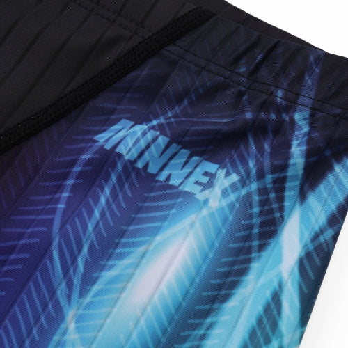 Close-up of 黑色男童泳褲 <68331022> fabric, showing a black and blue abstract pattern with MINWEI in white text. The design features diagonal lines and feather-like shapes.